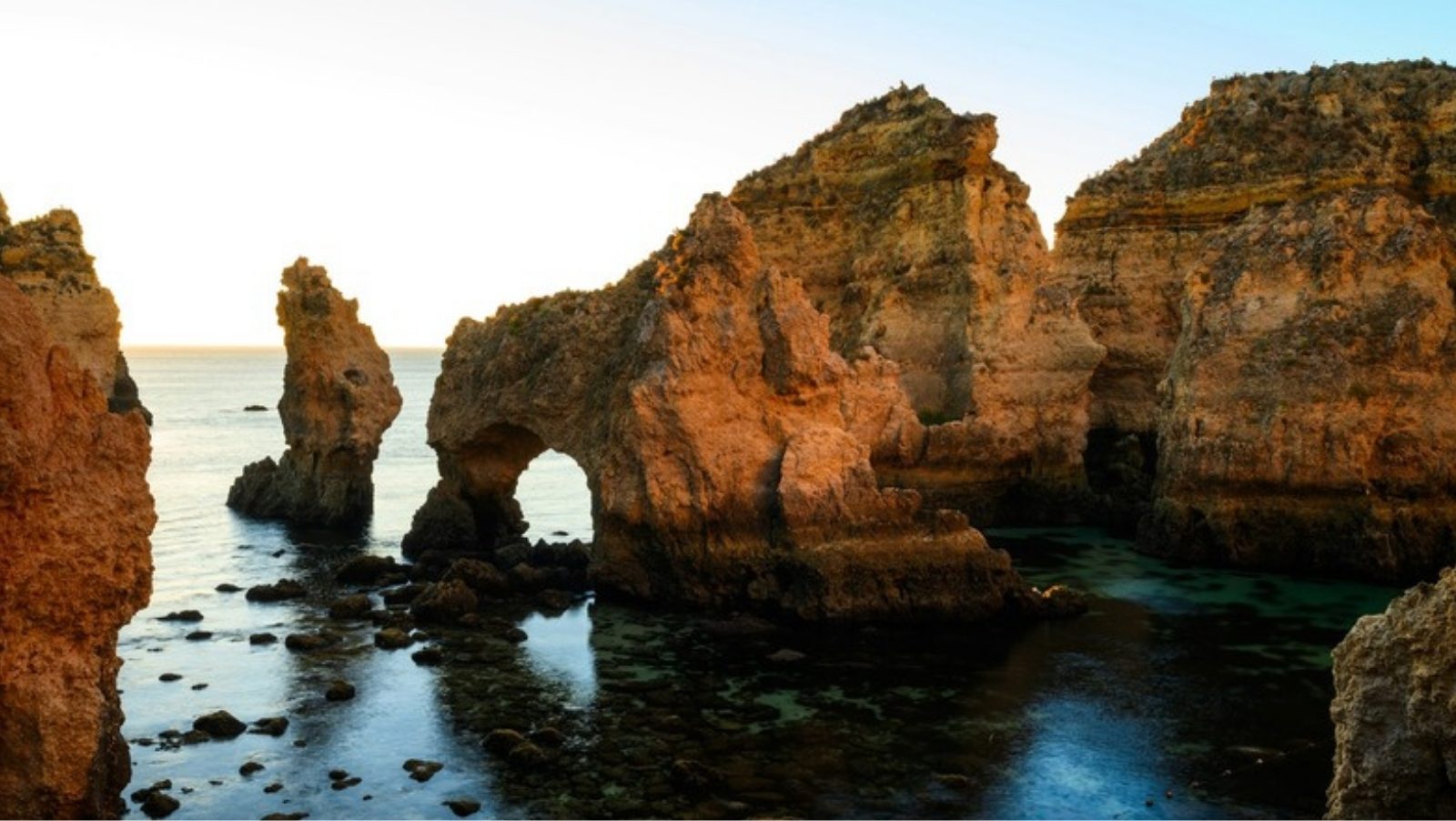 Golden limestone cliffs and rock arches at Ponta da Piedade near Lagos in the Algarve, Portugal